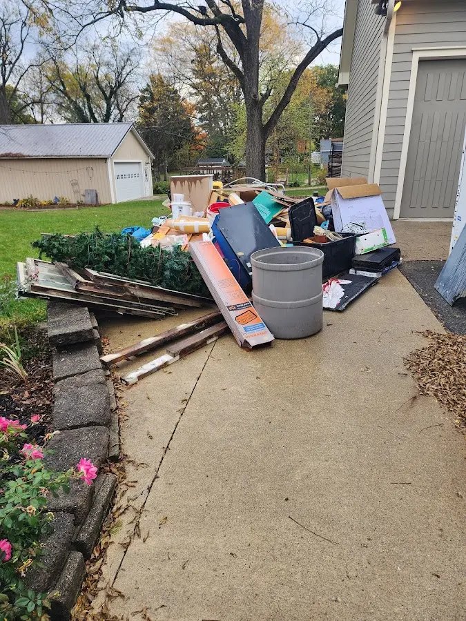 Dumpster being loaded with debris for Demolition Dumpster Rental in Wilmington Manor